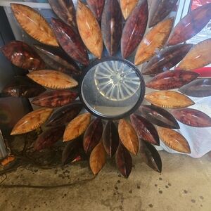 Elegant Sunburst Wall Mirror with Rich Tones